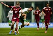 24 March 2025; Mason Melia of Republic of Ireland in action against Rajmund Toth of Hungary during the U21 International Friendly match between Republic of Ireland and Hungary at Pinatar Arena in Murcia, Spain. Photo by Manu Reino/Sportsfile