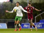 24 March 2025; Gabriel Otegbayo of Republic of Ireland in action against Gabor Jurek of Hungary during the U21 International Friendly match between Republic of Ireland and Hungary at Pinatar Arena in Murcia, Spain. Photo by Manu Reino/Sportsfile
