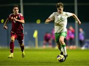 24 March 2025; Conor McManus of Republic of Ireland in action against Levente Babos of Hungary during the U21 International Friendly match between Republic of Ireland and Hungary at Pinatar Arena in Murcia, Spain. Photo by Manu Reino/Sportsfile