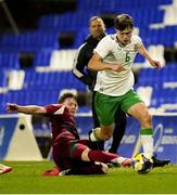 24 March 2025; Conor McManus of Republic of Ireland in action against Dominik Csoka of Hungary during the U21 International Friendly match between Republic of Ireland and Hungary at Pinatar Arena in Murcia, Spain. Photo by Manu Reino/Sportsfile