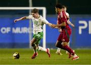 24 March 2025; Jamie Mullins of Republic of Ireland in action against Michael Okeke of Hungary during the U21 International Friendly match between Republic of Ireland and Hungary at Pinatar Arena in Murcia, Spain. Photo by Manu Reino/Sportsfile