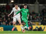 23 March 2025; Troy Parrott of Republic of Ireland in action against Simeon Petrov of Bulgaria during the UEFA Nations League B/C Play-off 2nd Leg match between Republic of Ireland and Bulgaria at the Aviva Stadium in Dublin. Photo by Michael P Ryan/Sportsfile