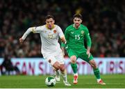 23 March 2025; Georgi Milanov of Bulgaria in action against Troy Parrott of Republic of Ireland during the UEFA Nations League B/C Play-off 2nd Leg match between Republic of Ireland and Bulgaria at the Aviva Stadium in Dublin. Photo by Michael P Ryan/Sportsfile