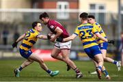 23 March 2025; Brían Cooney of Westmeath in action against Roscommon players, from left, Conor Hand and Cathal Heneghan during the Allianz Football League Division 2 match between Westmeath and Roscommon at TEG Cusack Park in Mullingar, Westmeath. Photo by Michael P Ryan/Sportsfile