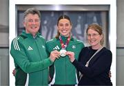 25 March 2025; Ireland athlete and pentathlon silver medallist Kate O'Connor with her father and coach Michael O'Connor and mother Valerie O'Connor upon her arrival at Dublin Airport from the World Indoor Athletics Championships at the Nanjing Youth Olympic Sports Park in Nanjing, China. Photo by Sam Barnes/Sportsfile