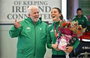 25 March 2025; Ireland athlete and pentathlon silver medallist Kate O'Connor with Athletics Ireland President John Cronin upon her arrival at Dublin Airport from the World Indoor Athletics Championships at the Nanjing Youth Olympic Sports Park in Nanjing, China. Photo by Sam Barnes/Sportsfile