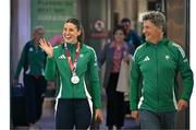 25 March 2025; Ireland athlete and pentathlon silver medallist Kate O'Connor with her father and coach Michael O'Connor upon their arrival at Dublin Airport from the World Indoor Athletics Championships at the Nanjing Youth Olympic Sports Park in Nanjing, China. Photo by Sam Barnes/Sportsfile