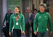 25 March 2025; Ireland athlete and pentathlon silver medallist Kate O'Connor with her father and coach Michael O'Connor upon their arrival at Dublin Airport from the World Indoor Athletics Championships at the Nanjing Youth Olympic Sports Park in Nanjing, China. Photo by Sam Barnes/Sportsfile