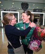 25 March 2025; Ireland athlete and pentathlon silver medallist Kate O'Connor is greeted by her mother Valerie O'Connor upon her arrival at Dublin Airport from the World Indoor Athletics Championships at the Nanjing Youth Olympic Sports Park in Nanjing, China. Photo by Sam Barnes/Sportsfile