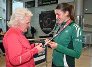 25 March 2025; Ireland athlete and pentathlon silver medallist Kate O'Connor with former Athletics Ireland President Georgina Drumm upon her arrival at Dublin Airport from the World Indoor Athletics Championships at the Nanjing Youth Olympic Sports Park in Nanjing, China. Photo by Sam Barnes/Sportsfile