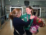 25 March 2025; Ireland athlete and pentathlon silver medallist Kate O'Connor is greeted by her mother Valerie O'Connor upon her arrival at Dublin Airport from the World Indoor Athletics Championships at the Nanjing Youth Olympic Sports Park in Nanjing, China. Photo by Sam Barnes/Sportsfile
