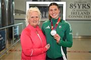 25 March 2025; Ireland athlete and pentathlon silver medallist Kate O'Connor with former Athletics Ireland President Georgina Drumm upon her arrival at Dublin Airport from the World Indoor Athletics Championships at the Nanjing Youth Olympic Sports Park in Nanjing, China. Photo by Sam Barnes/Sportsfile