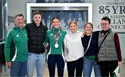 25 March 2025; Ireland athlete and pentathlon silver medallist Kate O'Connor, centre, with her family, from left, father and coach Michael O'Connor, brother Ruairi O'Connor, sister Meabh O'Connor, mother Valerie O'Connor and cousin George Allen upon her arrival at Dublin Airport from the World Indoor Athletics Championships at the Nanjing Youth Olympic Sports Park in Nanjing, China. Photo by Sam Barnes/Sportsfile