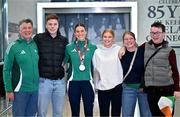 25 March 2025; Ireland athlete and pentathlon silver medallist Kate O'Connor, centre, with her family, from left, father and coach Michael O'Connor, brother Ruairi O'Connor, sister Meabh O'Connor, mother Valerie O'Connor and cousin George Allen upon her arrival at Dublin Airport from the World Indoor Athletics Championships at the Nanjing Youth Olympic Sports Park in Nanjing, China. Photo by Sam Barnes/Sportsfile