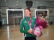 25 March 2025; Ireland athlete and pentathlon silver medallist Kate O'Connor upon her arrival at Dublin Airport from the World Indoor Athletics Championships at the Nanjing Youth Olympic Sports Park in Nanjing, China. Photo by Sam Barnes/Sportsfile