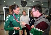 25 March 2025; Ireland athlete and pentathlon silver medallist Kate O'Connor with her cousin George Allen upon her arrival at Dublin Airport from the World Indoor Athletics Championships at the Nanjing Youth Olympic Sports Park in Nanjing, China. Photo by Sam Barnes/Sportsfile