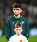 23 March 2025; Troy Parrott of Republic of Ireland and mascot Noah Clarke before the UEFA Nations League B/C Play-off 2nd Leg match between Republic of Ireland and Bulgaria at the Aviva Stadium in Dublin. Photo by Stephen McCarthy/Sportsfile
