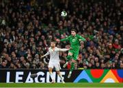 23 March 2025; Mikey Johnston of Republic of Ireland in action against Fabian Nuernberger of Bulgaria during the UEFA Nations League B/C Play-off 2nd Leg match between Republic of Ireland and Bulgaria at the Aviva Stadium in Dublin. Photo by Stephen McCarthy/Sportsfile