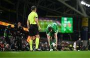 23 March 2025; Jimmy Dunne of Republic of Ireland picks up the ball, using a gaelic football technique, before taking a throw-in during the UEFA Nations League B/C Play-off 2nd Leg match between Republic of Ireland and Bulgaria at the Aviva Stadium in Dublin. Photo by Stephen McCarthy/Sportsfile