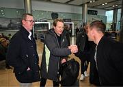 26 March 2025; Republic of Ireland head coach Colin O'Brien is greeted by FAI chief executive officer David Courell, left, and FAI assistant director of football Shane Robinson, right, on the team's arrival at Dublin Airport following their qualification for the FIFA U-17 World Cup to be held in Qatar, in November 2025. The team reached the Finals for the first time in their history as one of four best-placed runners-up for qualification for the UEFA European Under-17 Championships. Their final standing position of second in Group A6, held in Poland, with six points, seven goals scored and just one goal conceded saw them miss out on the U17 EUROs but it was still enough to see them confirm a place at the World Cup in November. Photo by Stephen McCarthy/Sportsfile
