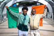 26 March 2025; Ade Solanke of the Republic of Ireland with his father Michael on the team's arrival at Dublin Airport following their qualification for the FIFA U-17 World Cup to be held in Qatar, in November 2025. The team reached the Finals for the first time in their history as one of four best-placed runners-up for qualification for the UEFA European Under-17 Championships. Their final standing position of second in Group A6, held in Poland, with six points, seven goals scored and just one goal conceded saw them miss out on the U17 EUROs but it was still enough to see them confirm a place at the World Cup in November. Photo by Stephen McCarthy/Sportsfile