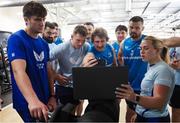 27 March 2025; Athletic performance intern Molly Sullivan, right, with players, from left, Brian Deeny, Rory McGuire, Alex Soroka, Lee Barron, Will Connors, John McKee, Thomas Clarkson and Max Deegan during a Leinster Rugby squad gym session in Durban, South Africa. Photo by Shaun Roy/Sportsfile