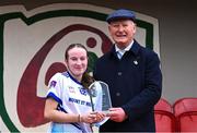 27 March 2025; Lily Hession of Mount St Michael receives the Player of the Match award from LGFA Vice-President Brendan Cregg after her side's victory in the Lidl LGFA PPS All-Ireland Senior B final match between Eureka Secondary School of Kells in Meath and Mount St Michael of Claremorris in Mayo at St Brigid's GAA in Roscommon. Photo by Piaras Ó Mídheach/Sportsfile