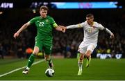 23 March 2025; Nathan Collins of Republic of Ireland and Kiril Despodov of Bulgaria during the UEFA Nations League B/C Play-off 2nd Leg match between Republic of Ireland and Bulgaria at the Aviva Stadium in Dublin. Photo by Ben McShane/Sportsfile