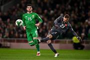 23 March 2025; Bulgaria goalkeeper Plamen Iliev and Troy Parrott of Republic of Ireland during the UEFA Nations League B/C Play-off 2nd Leg match between Republic of Ireland and Bulgaria at the Aviva Stadium in Dublin. Photo by Ben McShane/Sportsfile