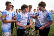 28 March 2025; DLR captain Louis Grehan, centre, and team-mates celebrate after their victory in the match between DLR and FCC during the Leinster Rugby 2025 Metropolitan County Council Cup Finals at Energia Park in Dublin. Photo by Shauna Clinton/Sportsfile