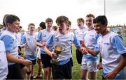 28 March 2025; DLR captain Louis Grehan, centre, and team-mates celebrate after their victory in the match between DLR and FCC during the Leinster Rugby 2025 Metropolitan County Council Cup Finals at Energia Park in Dublin. Photo by Shauna Clinton/Sportsfile