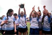 28 March 2025; DLR captain Lucy Scanlon, centre, celebrates with team-mates after their side's victory in the match between DCC and DLR during the Leinster Rugby 2025 Metropolitan County Council Cup Finals at Energia Park in Dublin. Photo by Shauna Clinton/Sportsfile