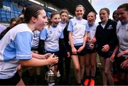 28 March 2025; DLR captain Lucy Scanlon, centre, celebrates with team-mates after their side's victory in the match between DCC and DLR during the Leinster Rugby 2025 Metropolitan County Council Cup Finals at Energia Park in Dublin. Photo by Shauna Clinton/Sportsfile