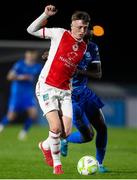 28 March 2025; Chris Forrester of St Patrick's Athletic in action against James Olayinka of Waterford during the SSE Airtricity Men's Premier Division match between Waterford and St Patrick's Athletic at the Regional Sports Centre in Waterford. Photo by Michael P Ryan/Sportsfile