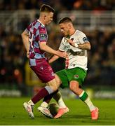 28 March 2025; Sean Murray of Cork City is tackled by Warren Davis of Drogheda United during the SSE Airtricity Men's Premier Division match between Cork City and Drogheda United at Turner's Cross in Cork. Photo by Tom Beary/Sportsfile