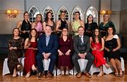 28 March 2025; The AIG Ladies HEC All-Stars 2025 team of the year, back row, from left to right, Emma Duggan of DCU Dóchas Éireann, Sarah Reynolds of DCU Dóchas Éireann, Hannah McGinnis of DCU Dóchas Éireann, Aoife Healy of University College Cork, Rachel Dwyer of Mary Immaculate College Limerick, Natalie, accepting the award on behalf of her daughter Katie O’Driscoll of Munster Technological University Cork, and mother of Emily Lacey of University College Cork; front row, from left to right, Niamh Donlon of DCU Dóchas Éireann, Robyn Murray of DCU Dóchas Éireann, Daniel Caldwell, Chairperson Ladies HEC; Ladies Gaelic Football Association President Trina Murray; John Gillick, Head of Consumer Marketing and Sponsorship, AIG Ireland; Clodagh Lohan of DCU Dóchas Éireann and Eve Power of University College Cork; at the 2025 AIG Ladies HEC All-Stars and Rising Stars evening, at the Dublin Bonnington Hotel. Photo by Ramsey Cardy/Sportsfile