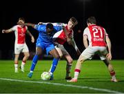 28 March 2025; James Olayinka of Waterford in action against Chris Forrester of St Patrick's Athletic during the SSE Airtricity Men's Premier Division match between Waterford and St Patrick's Athletic at the Regional Sports Centre in Waterford. Photo by Michael P Ryan/Sportsfile