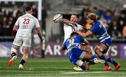 28 March 2025; Stuart McCloskey of Ulster offloads to teammate Zac Ward, 23, as he is tackled by Jurie Matthee, left, and Evan Roos of DHL Stormers during the United Rugby Championship match between Ulster and DHL Stormers at the Kingspan Stadium in Belfast. Photo by Ben McShane/Sportsfile