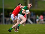 23 March 2025; Matthew Costello of Meath in action against Peter Lynch of Louth during the Allianz Football League Division 2 match between Louth and Meath at Grattan Park in Inniskeen, Monaghan. Photo by Daire Brennan/Sportsfile