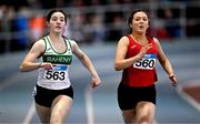 29 March 2025; Olivia Meikle of Raheny Shamrock AC, Dublin, left, and Isobel Canty of Fr. Murphy AC, Meath, compete in the Girls U17 200m during day one of the 123.ie National Indoor Juvenile Championships at the TUS Indoor Arena in Athlone, Westmeath. Photo by Ben McShane/Sportsfile