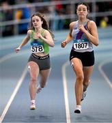 29 March 2025; Naoise Cronin of Killarney Valley AC, Kerry, left, competes in the Girls U17 200m during day one of the 123.ie National Indoor Juvenile Championships at the TUS Indoor Arena in Athlone, Westmeath. Photo by Ben McShane/Sportsfile