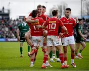 29 March 2025; Munster players, from left, Seán O’Brien, 11, Gavin Coombes, Jack Crowley, 10, and Conor Murray celebrate after their side's victory in the United Rugby Championship match between Connacht and Munster at Hastings Insurance MacHale Park in Castlebar, Mayo. Photo by Seb Daly/Sportsfile