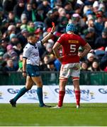 29 March 2025; Referee Craig Evans shows Alex Nankivell of Munster, not pictured, a red card as  Tadhg Beirne of Munster watches on during the United Rugby Championship match between Connacht and Munster at Hastings Insurance MacHale Park in Castlebar, Mayo. Photo by Tyler Miller/Sportsfile