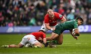 29 March 2025; Josh Ioane of Connacht is tackled by Munster players Alex Nankivell, left, and Jeremy Loughman during the United Rugby Championship match between Connacht and Munster at Hastings Insurance MacHale Park in Castlebar, Mayo. Photo by Seb Daly/Sportsfile