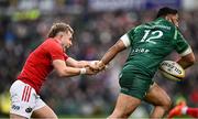 29 March 2025; Craig Casey of Munster attempts to tackle Bundee Aki of Connacht during the United Rugby Championship match between Connacht and Munster at Hastings Insurance MacHale Park in Castlebar, Mayo. Photo by Seb Daly/Sportsfile