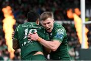 29 March 2025; Josh Ioane of Connacht, left, celebrates with teammate Finn Treacy after scoring their side's fourth try during the United Rugby Championship match between Connacht and Munster at Hastings Insurance MacHale Park in Castlebar, Mayo. Photo by Seb Daly/Sportsfile