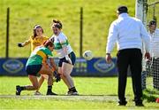 30 March 2025; Ana Mulholland of Antrim shoots to socre her side's first goal despite the efforts of Charlene Tyrell of Leitrim, left, and Leitrim goalkeeper Michelle Monaghan during the Lidl Ladies National Football League Division 4 semi-final match between Antrim and Leitrim at O'Raghallaigh Park in Kingscourt, Cavan. Photo by Tyler Miller/Sportsfile