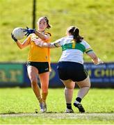 30 March 2025; Ana Mulholland of Antrim in action against Leitrim goalkeeper Michelle Monaghan during the Lidl Ladies National Football League Division 4 semi-final match between Antrim and Leitrim at O'Raghallaigh Park in Kingscourt, Cavan. Photo by Tyler Miller/Sportsfile