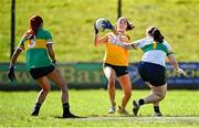 30 March 2025; Ana Mulholland of Antrim in action against Charlene Tyrell of Leitrim, left, and Leitrim goalkeeper Michelle Monaghan during the Lidl Ladies National Football League Division 4 semi-final match between Antrim and Leitrim at O'Raghallaigh Park in Kingscourt, Cavan. Photo by Tyler Miller/Sportsfile