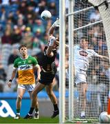 30 March 2025; Offaly goalkeeper Paddy Dunican loses possession as he's tackled by Niall Kelly of Kildare in the build-up to Kildare's first goal, scored by Harry O'Neill, not pictured, during the Allianz Football League Division 3 final match between Kildare and Offaly at Croke Park in Dublin. Photo by Piaras Ó Mídheach/Sportsfile